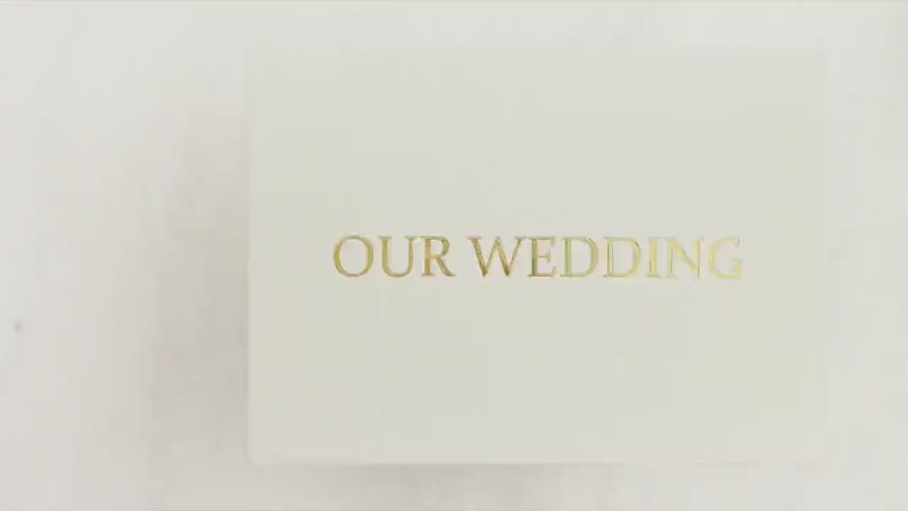 Interactive Motion Book showcasing a couple’s wedding highlights in a luxury video album format